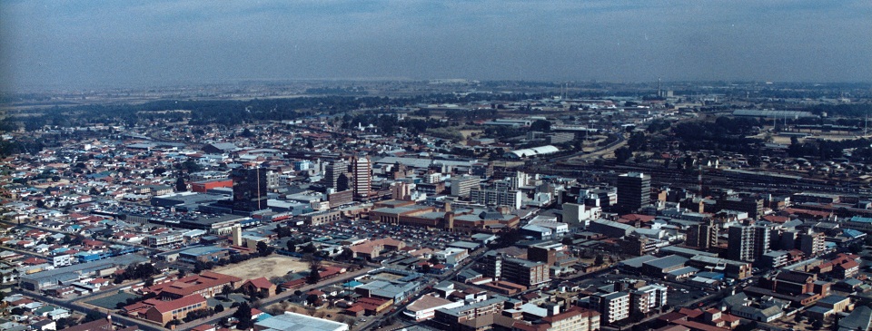 designer pool covers An aerial view of the city with pool covers on buildings in Johannesburg.